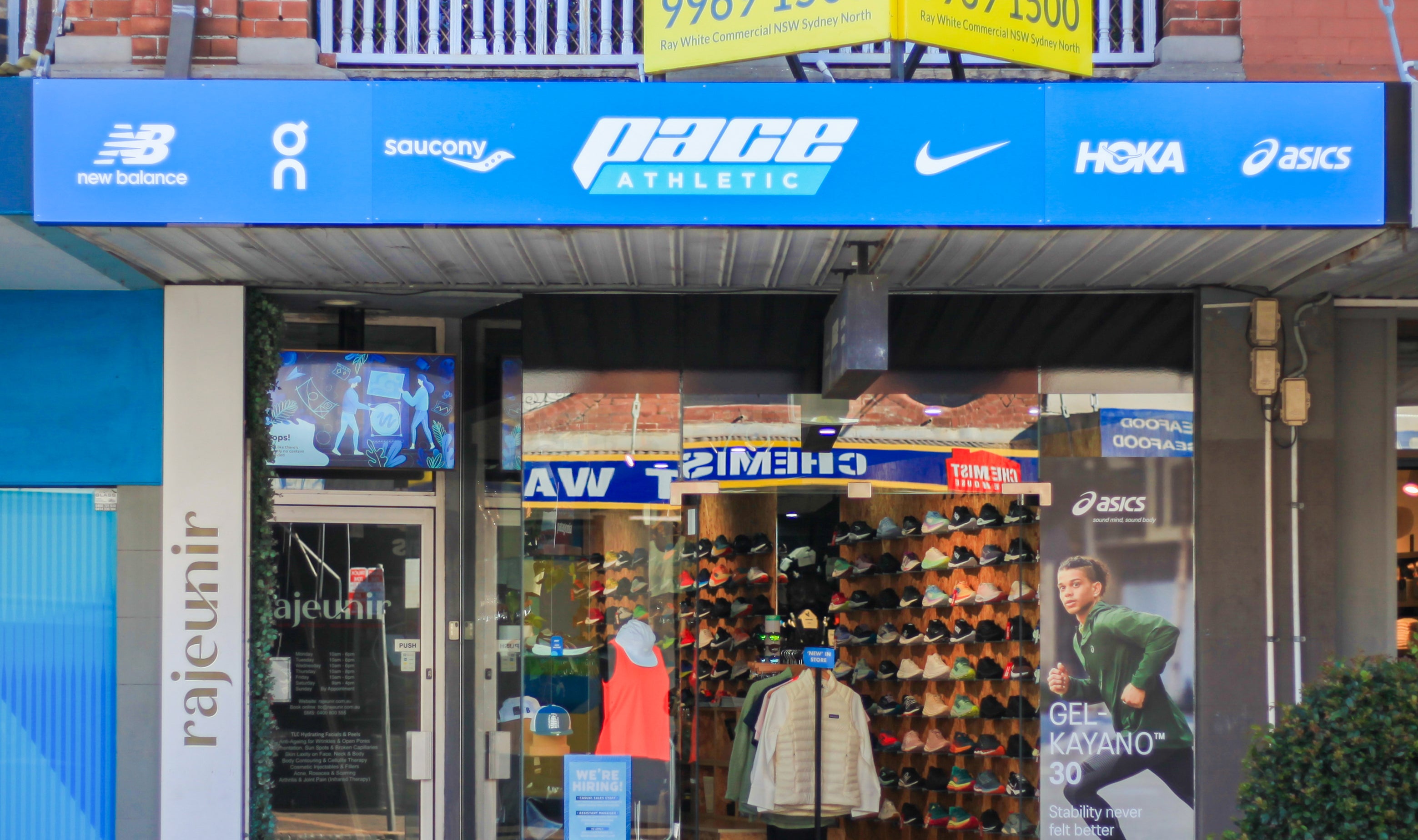 Pace retail storefront with running shoes on display.